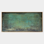 Framed Wabi-Sabi wall art in earthy green tones and aged textures.