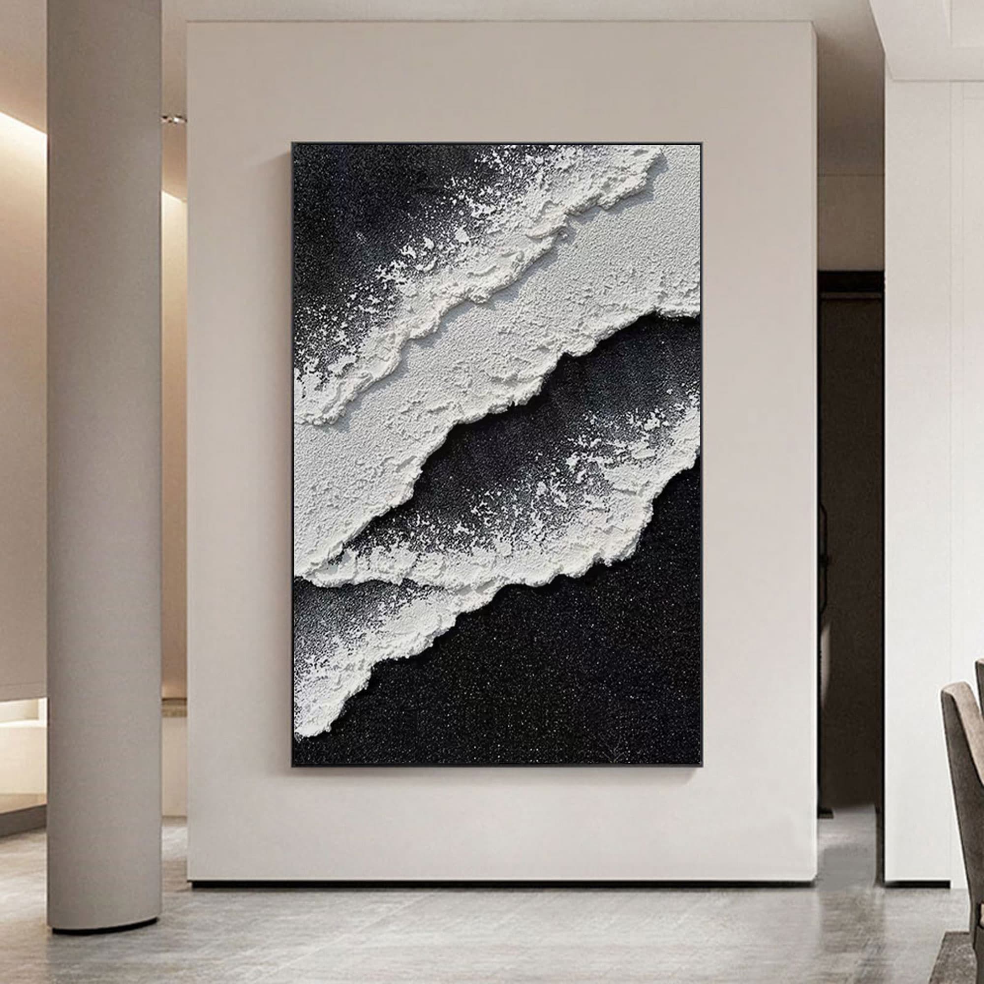 3D textured abstract wave painting in modern office wall with black and white tones on vertical oversized hand-painted canvas