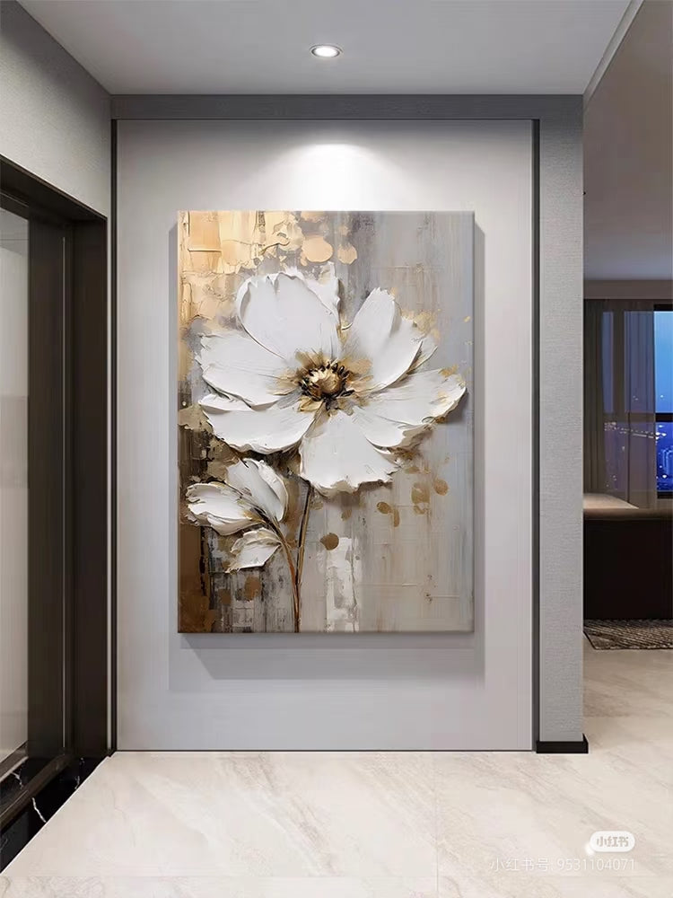 Vertical display of white and gold flower art in a hallway.