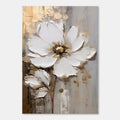 Close-up of 3D textured white and gold flower wall art.