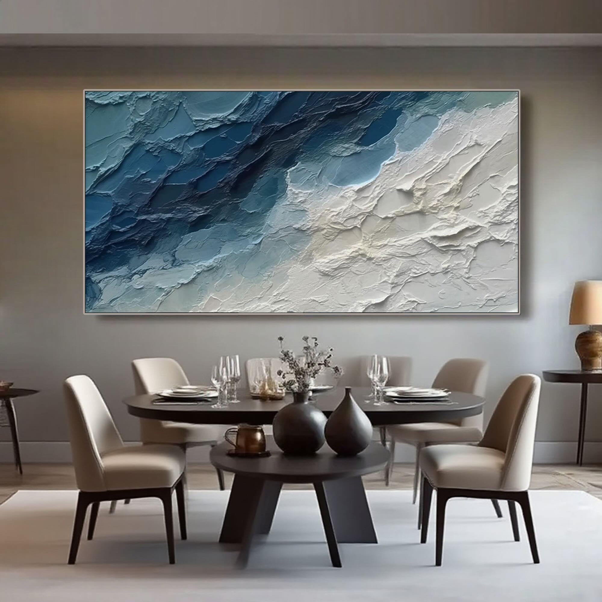 Close-up of brushstrokes and texture on the blue abstract canvas.