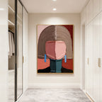 Lumi Gallery hand-painted modern abstract portrait wall art 'Quiet Figure' with pink, brown, red, blue accents, gold frame, in contemporary hallway