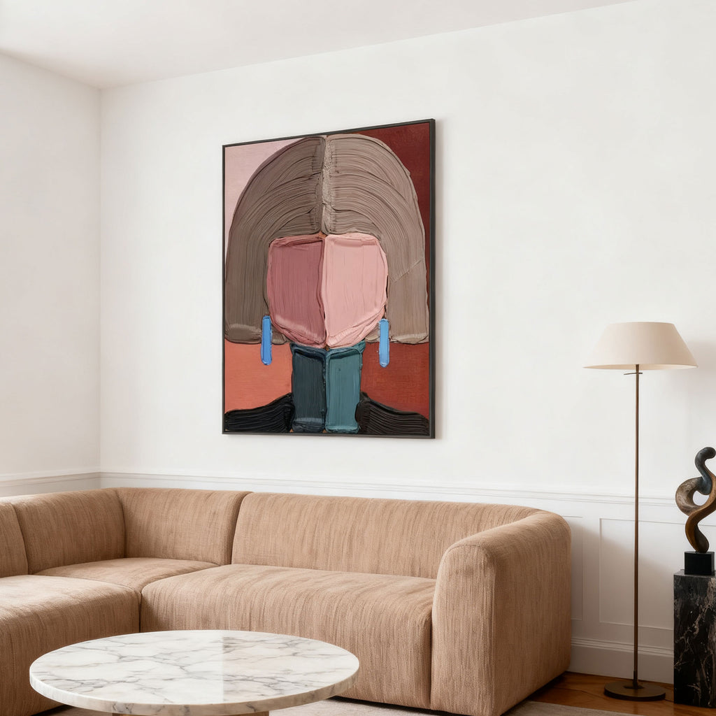 Modern abstract portrait canvas art with earthy tones on white wall above beige sofa at Lumi Gallery