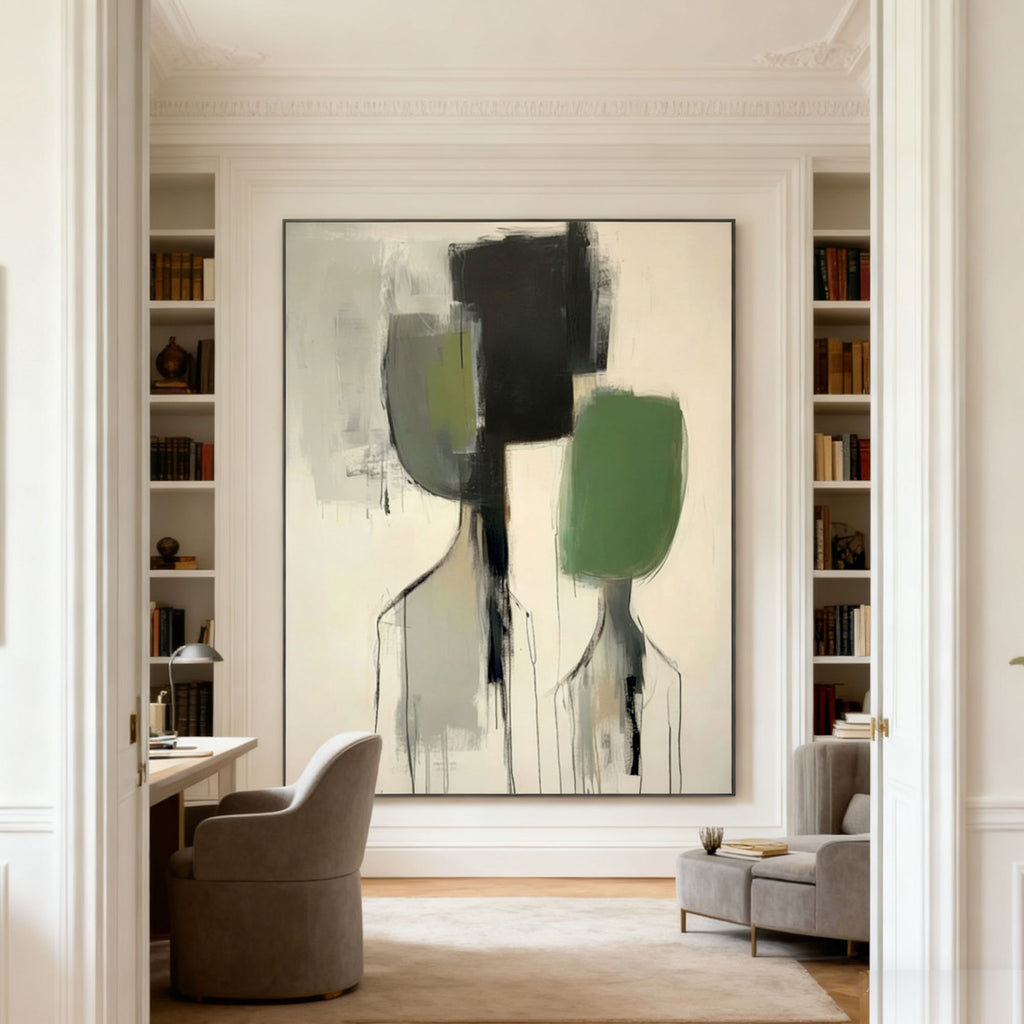 Modern abstract portrait wall art 'Distance' with two figures in black, green, and gray on a beige canvas, displayed in a bright room with built-in bookshelves and a desk.