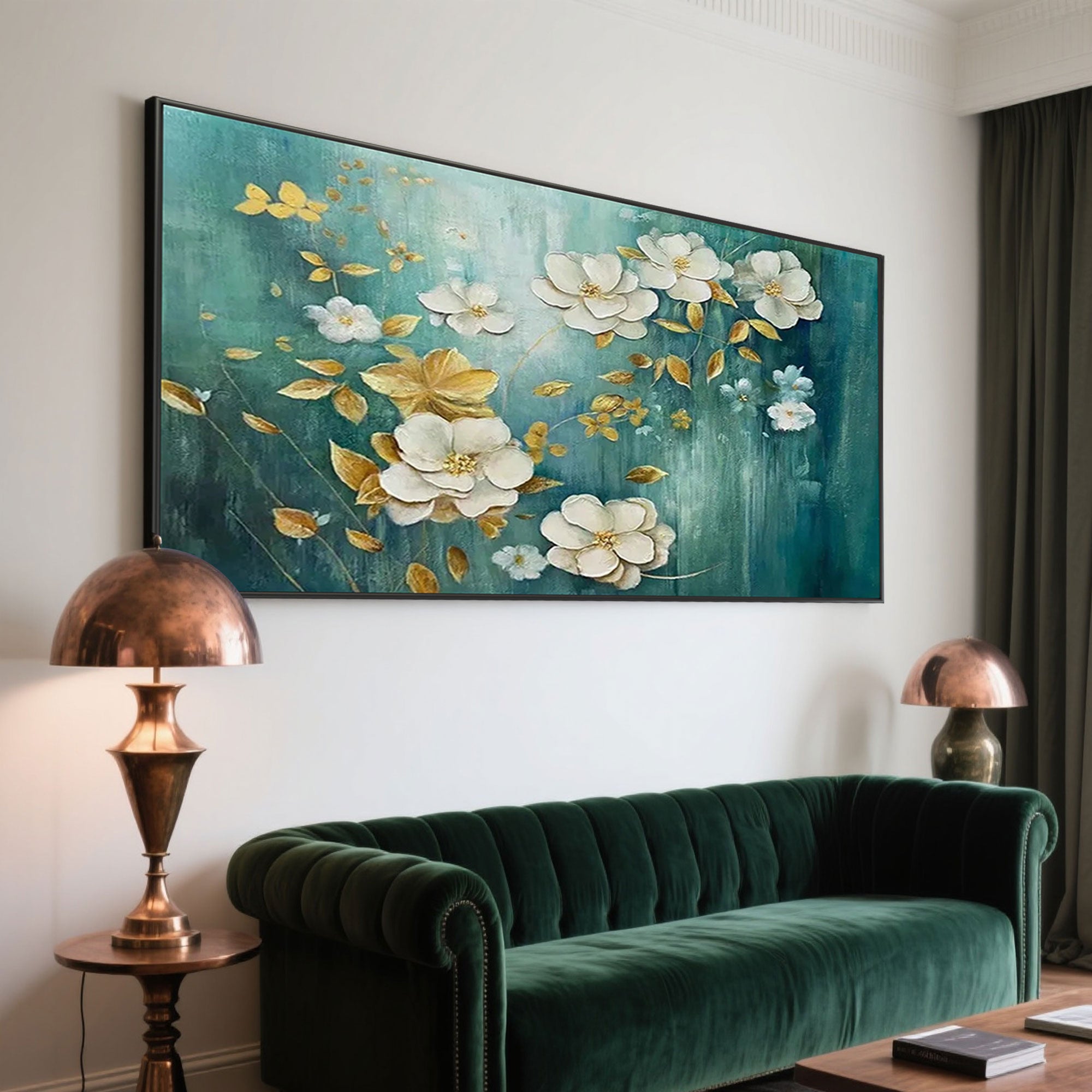 Green and gold floral wall art above a green sofa in living room setting.