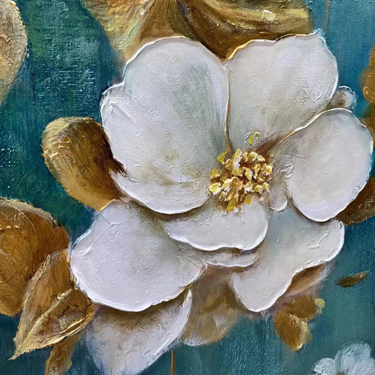 Close-up of textured white flower with gold accents on green canvas art