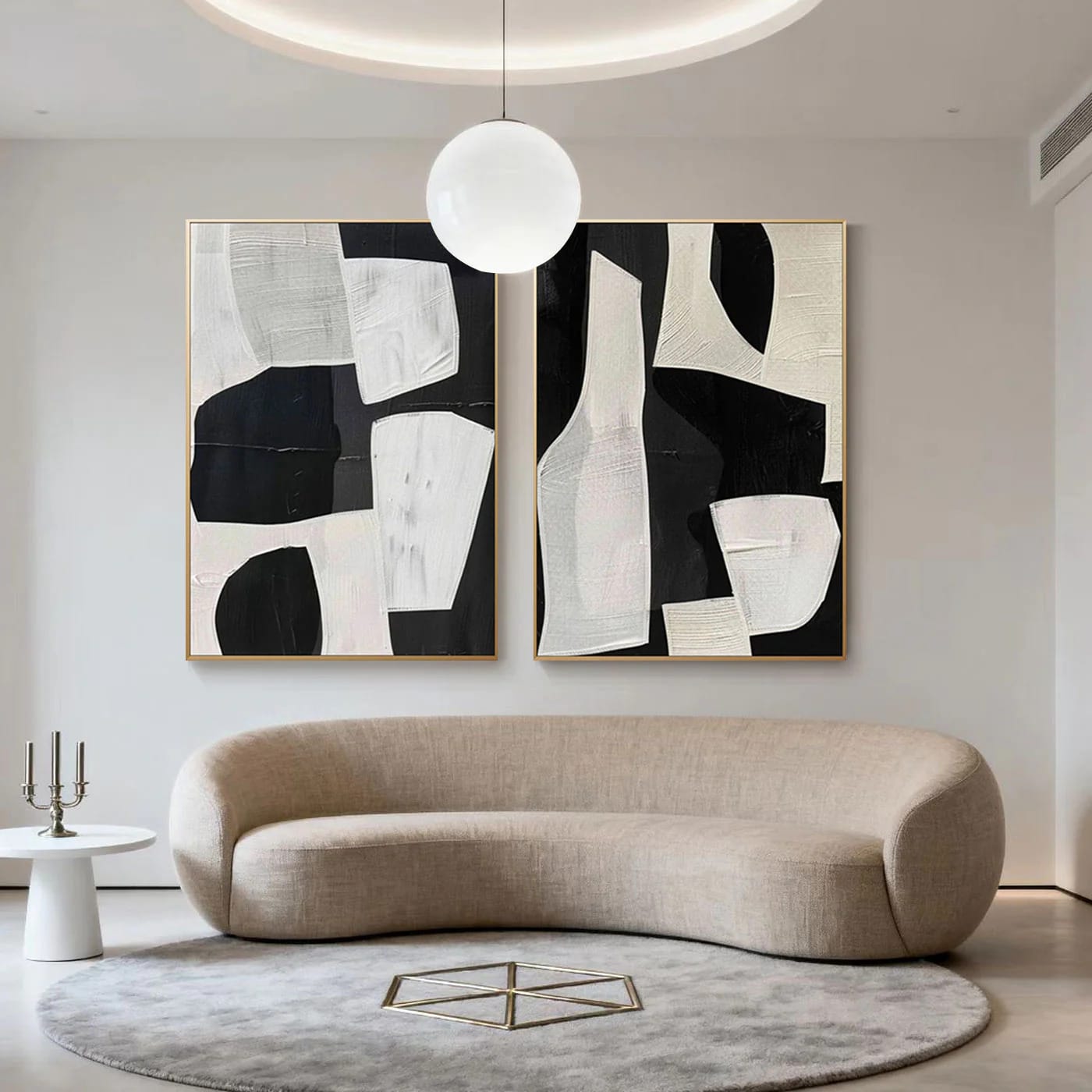 Modern geometric abstract hand-painted wall art in black/white, beige living room with curved sofa