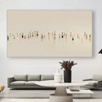 Abstract art piece on a wall above a modern living room setup.