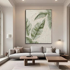 Modern minimalist botanical wall art with textured banana leaves in contemporary living room