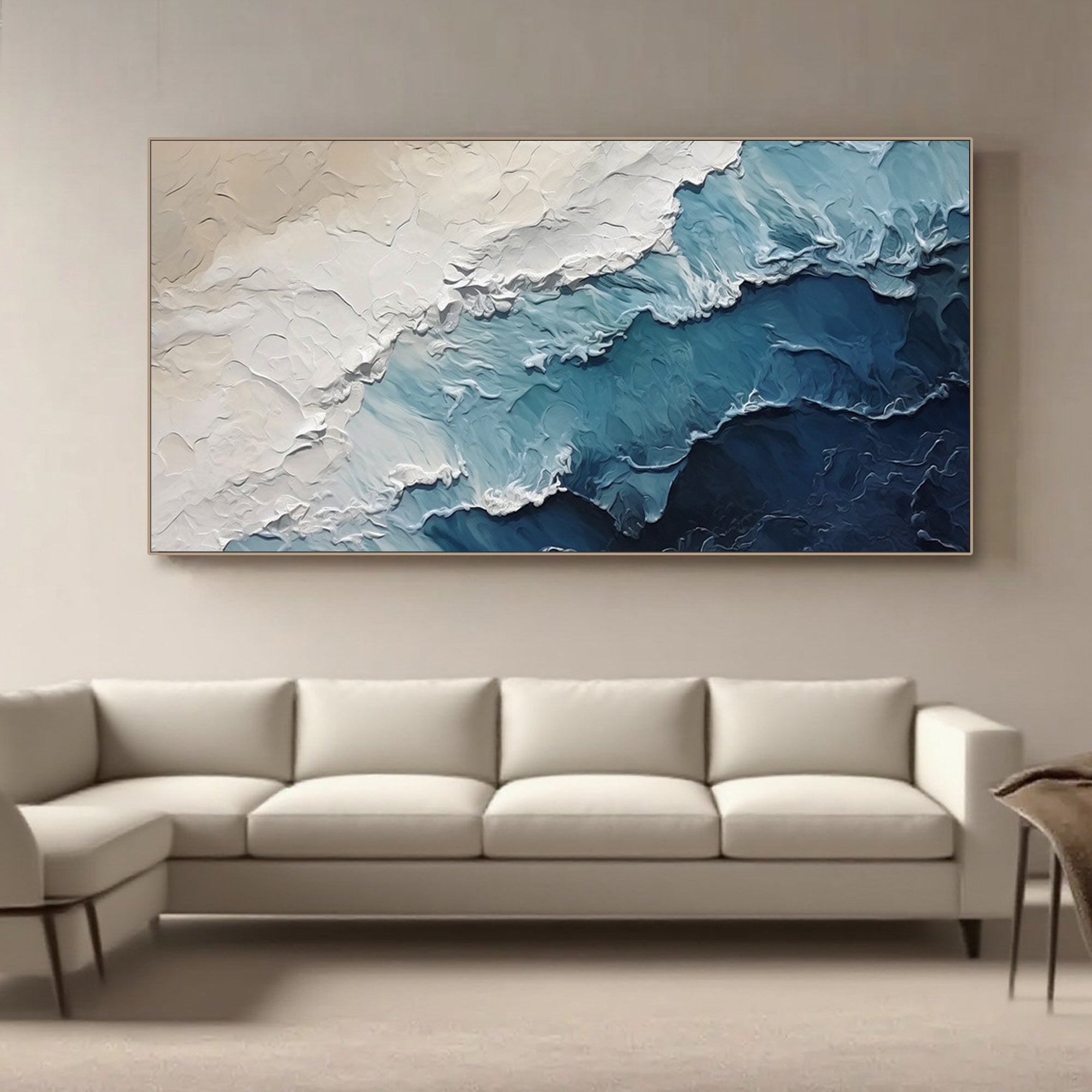 Deepshore ocean wave art above a modern white sofa, enhancing a serene living room.