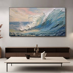 Ocean wave art on canvas above console table in living room setting.