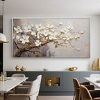 Contemporary dining area featuring beige floral art above a gray sideboard.