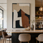 Modern interior with abstract art on the wall, marble countertop, and chairs.