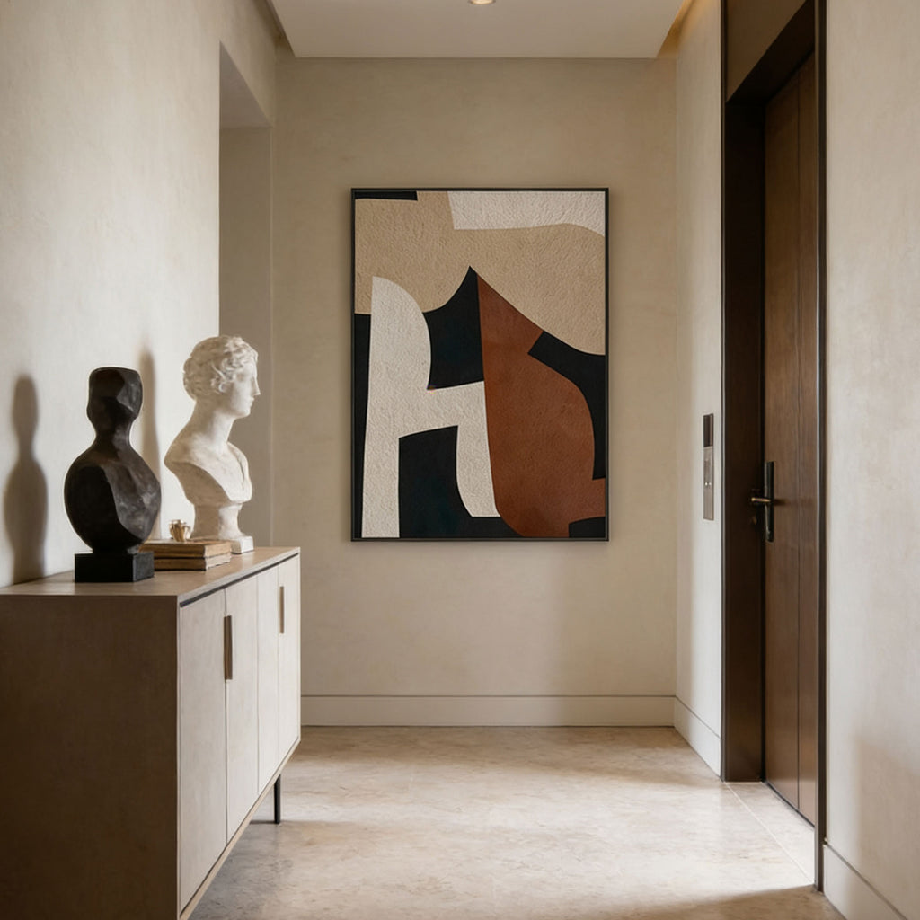 Modern interior with abstract art, sculptures, and a cabinet.