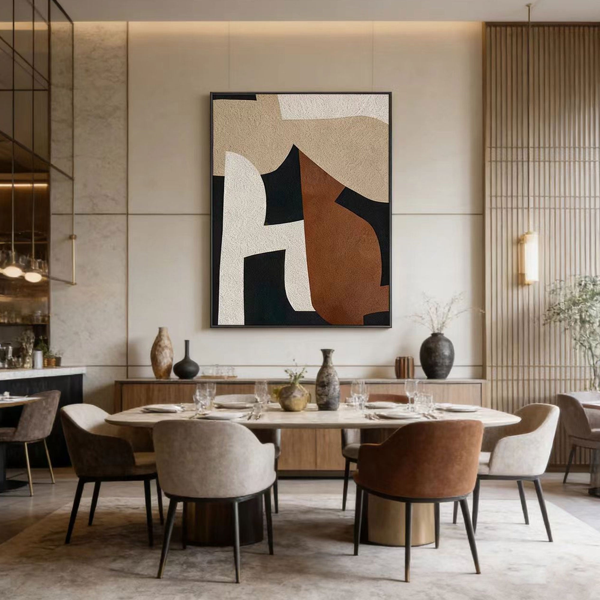 Modern dining room with abstract art on the wall and a round table with chairs.