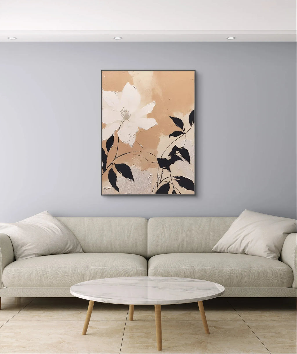 Neutral toned floral painting with creamy texture and minimalist white flower on beige canvas