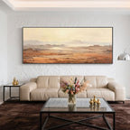Panoramic earth-tone canvas art in a modern living room setting.