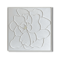 Close-up of white plaster art texture painting with a floral design.