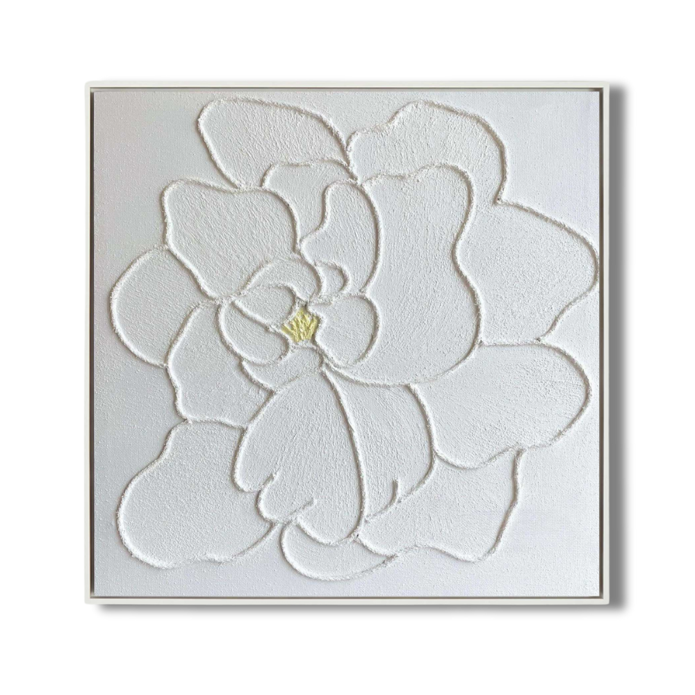 Close-up of white plaster art texture painting with a floral design.