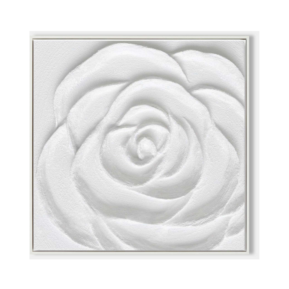 Close-up of a white plaster art texture painting of a rose in a white frame.