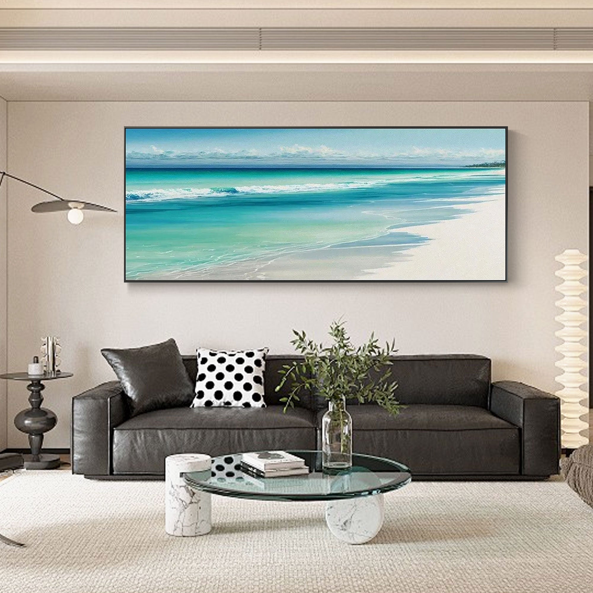 Turquoise shore canvas art with black frame in a living room setting.
