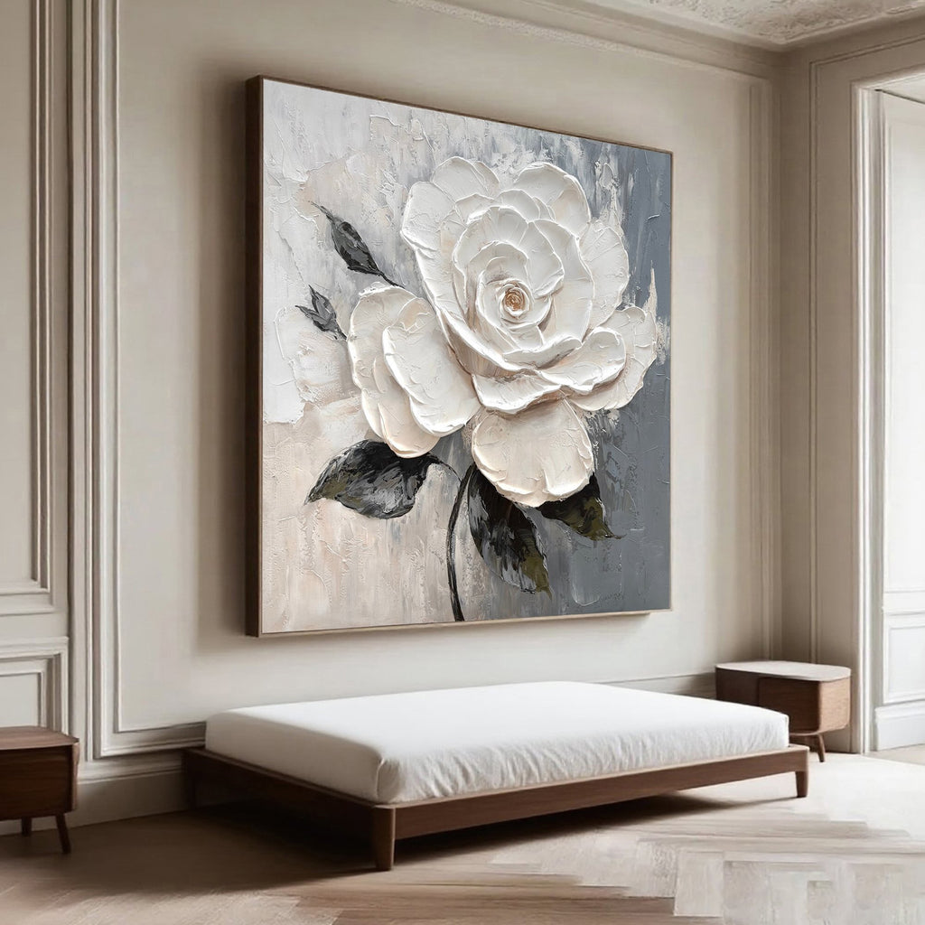 3D textured white roses with velvet petals, hand-painted canvas wall art displayed in a modern bedroom with soft gray and beige background.