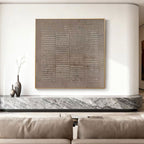 Lumi Gallery's Wabi Sabi Japandi brown beige canvas art 'Earthen Matrix' with gold frame, mounted on white wall above marble console