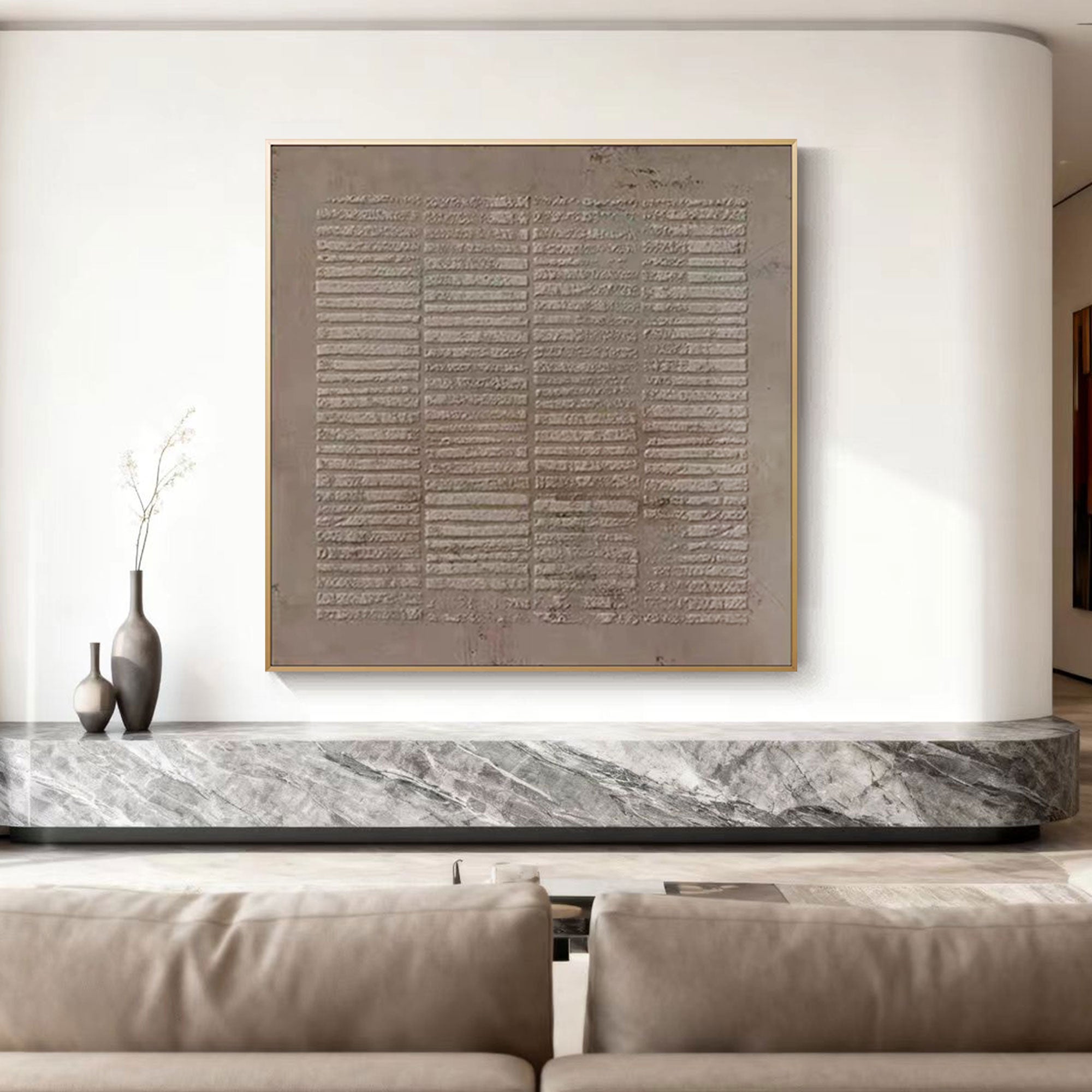 Lumi Gallery's Wabi Sabi Japandi brown beige canvas art 'Earthen Matrix' with gold frame, mounted on white wall above marble console