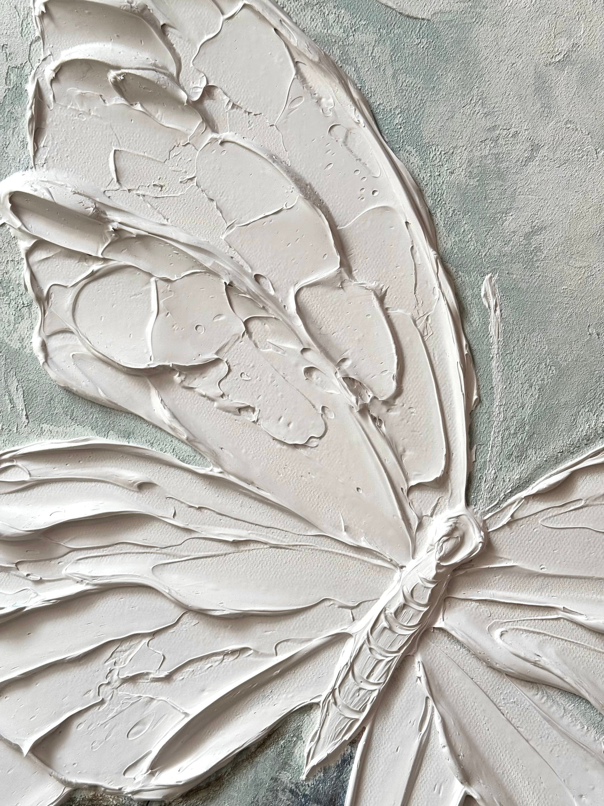 Minimalist white 3D textured butterfly canvas art by Lumi Gallery