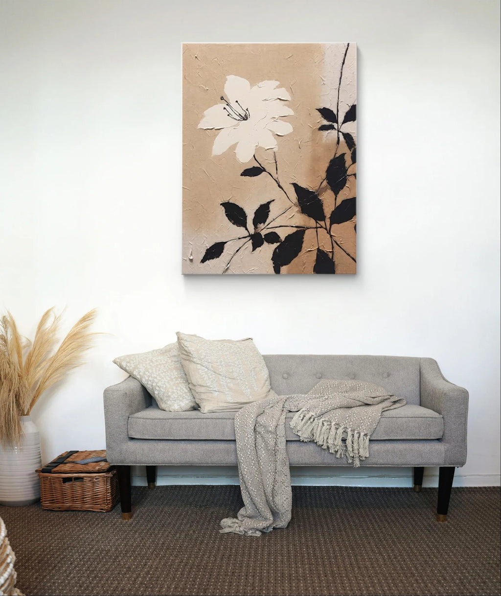 Textured beige floral wall art with a white flower and black leaves on canvas