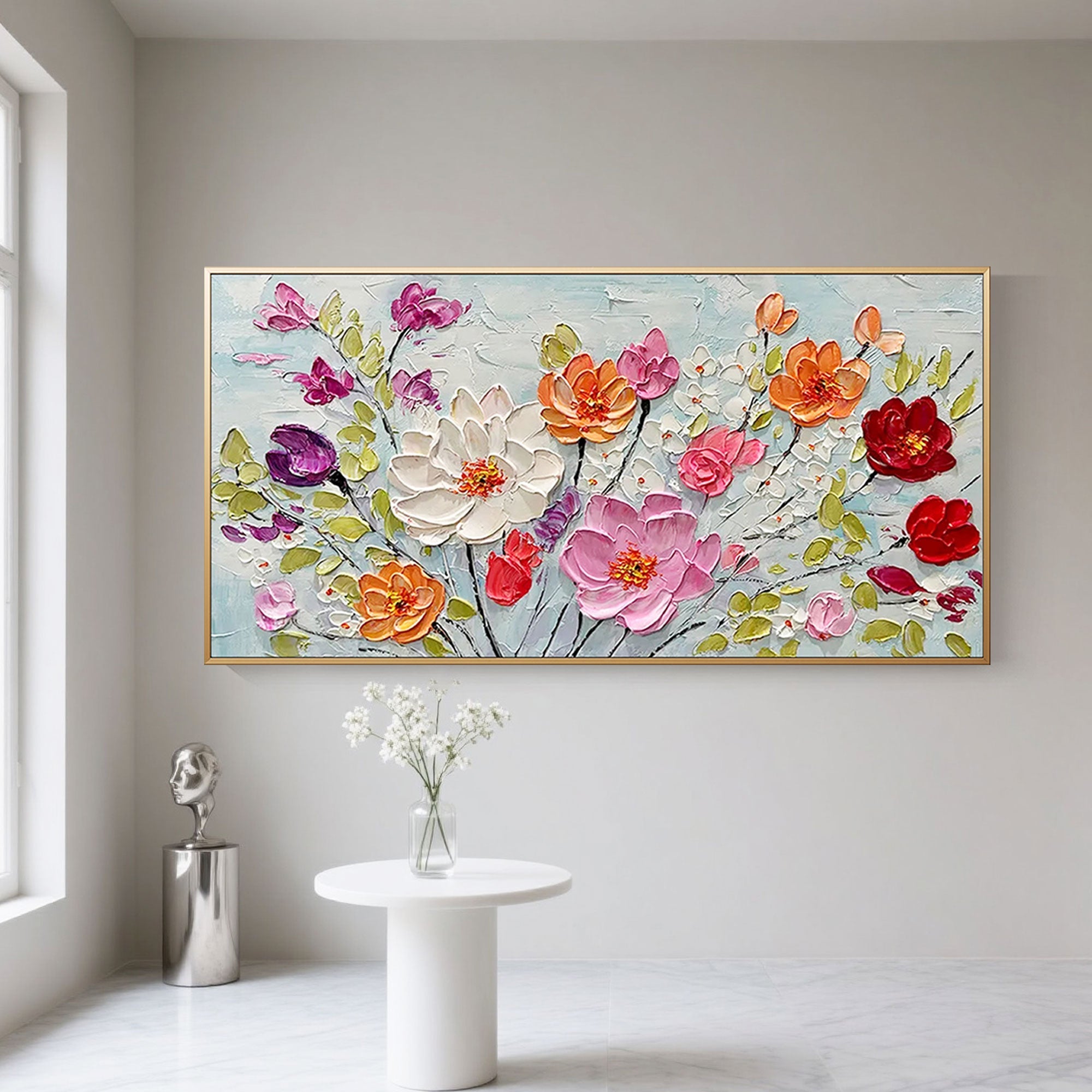 Colorburst floral art with gold frame in living room setting.