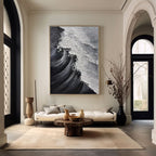 Textured ocean wave art in a modern entryway with neutral tones.