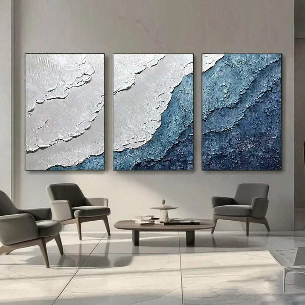 Textured ocean canvas art displayed in a modern living room setting.