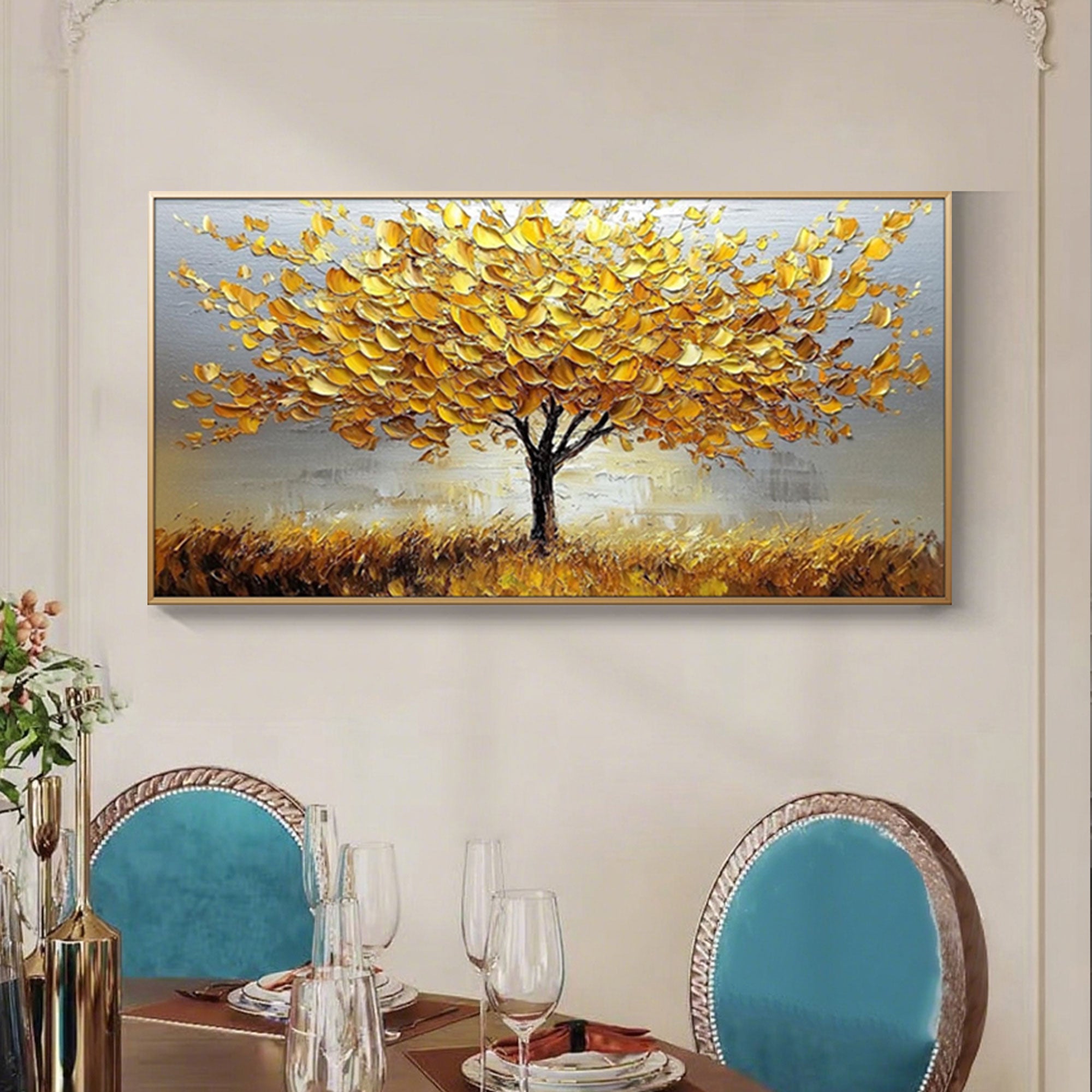 Textured 'Tree of Dawn' art above teal chairs.
