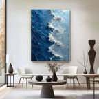 Azure Silence ocean wave art displayed above a dining table in a modern dining room.