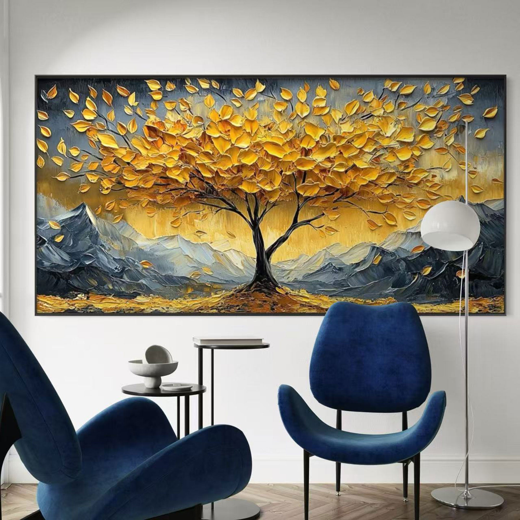 'Golden Drift' tree landscape painting in a modern living room with blue chairs.