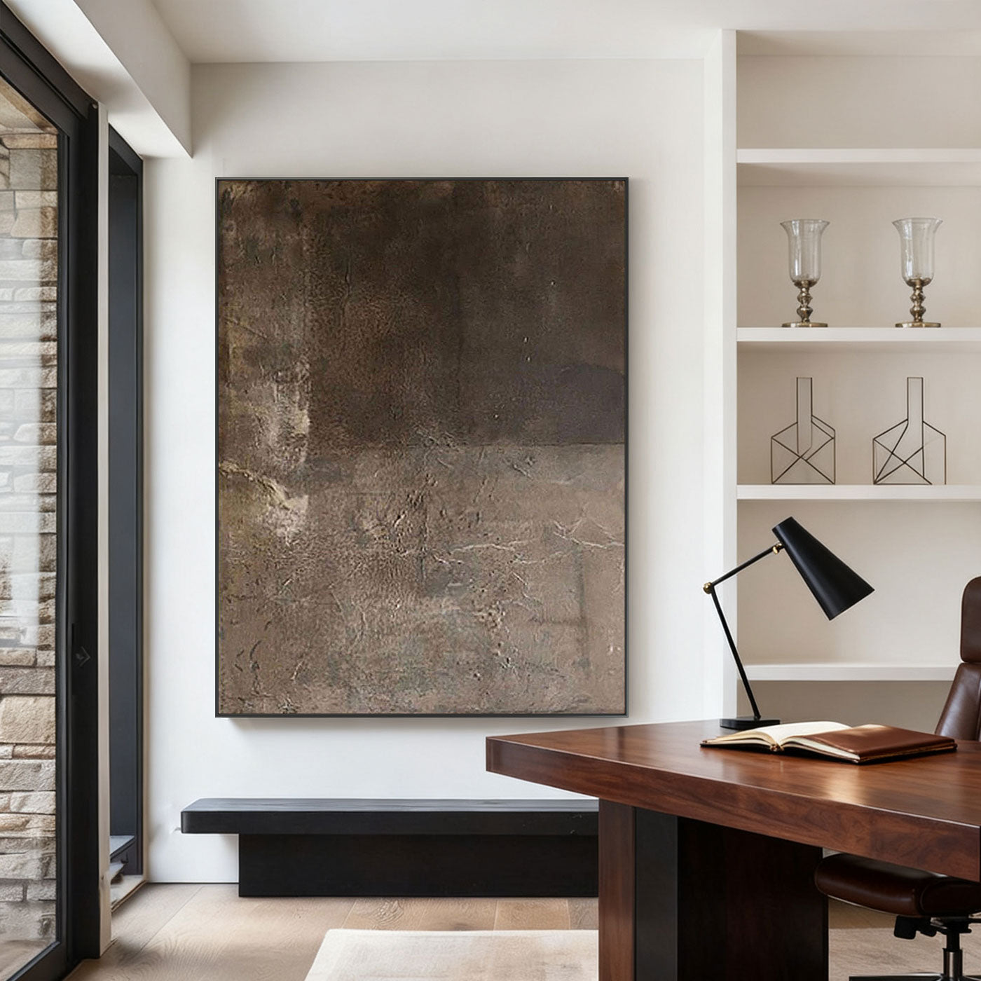 Large minimalist Wabi-Sabi abstract painting with textured earthy brown layers, displayed in a modern office with wooden desk and white shelves.