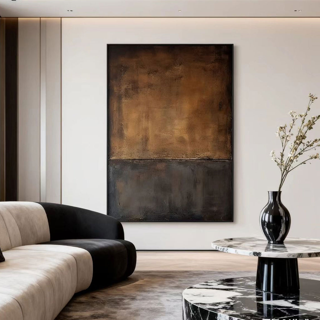 Minimalist Wabi-Sabi brown abstract wall art with textured earthy tones, displayed in a modern living room with a curved sofa and marble coffee table.