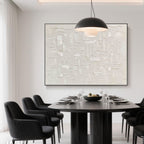Wabi Sabi art above a black dining table in an elegant dining room.