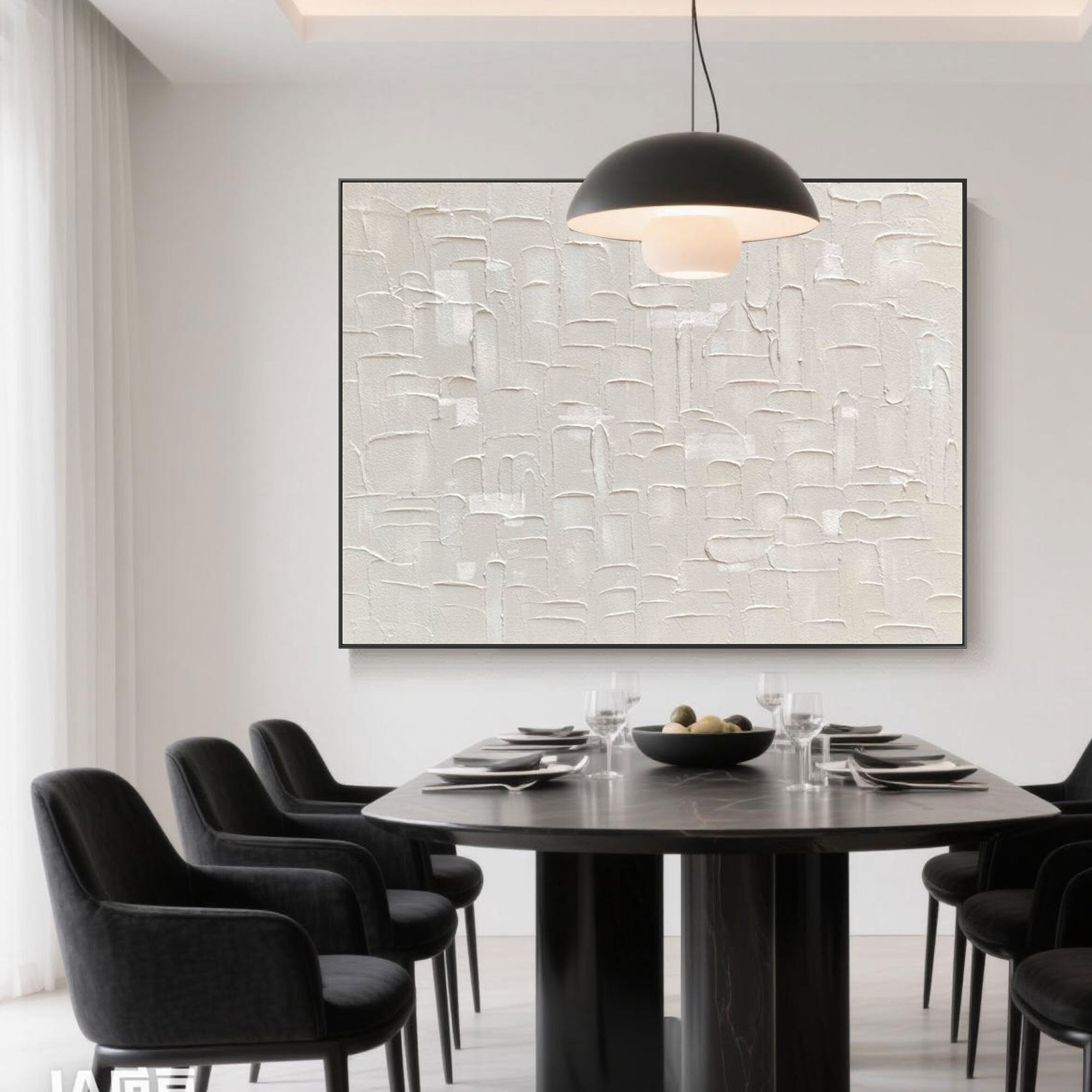 Wabi Sabi art above a black dining table in an elegant dining room.