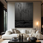Wabi Sabi black textured art above a couch in a modern living room.