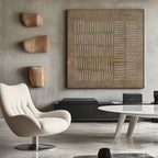 Minimalist canvas art in a modern living room with a white swivel chair.