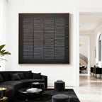 Black textured geometric wall art 'Weathered Grid' with gold frame in modern living room