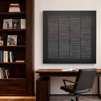 Lumi Gallery's black wabi-sabi textured grid painting in modern office with wooden desk