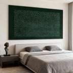 Lumi Gallery's dark green geometric textured wall art with circular patterns, above modern bedroom bed.