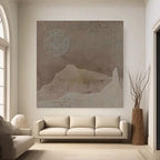 Wabi Sabi brown canvas art in minimalist living room. Textured sun and mountain shapes.