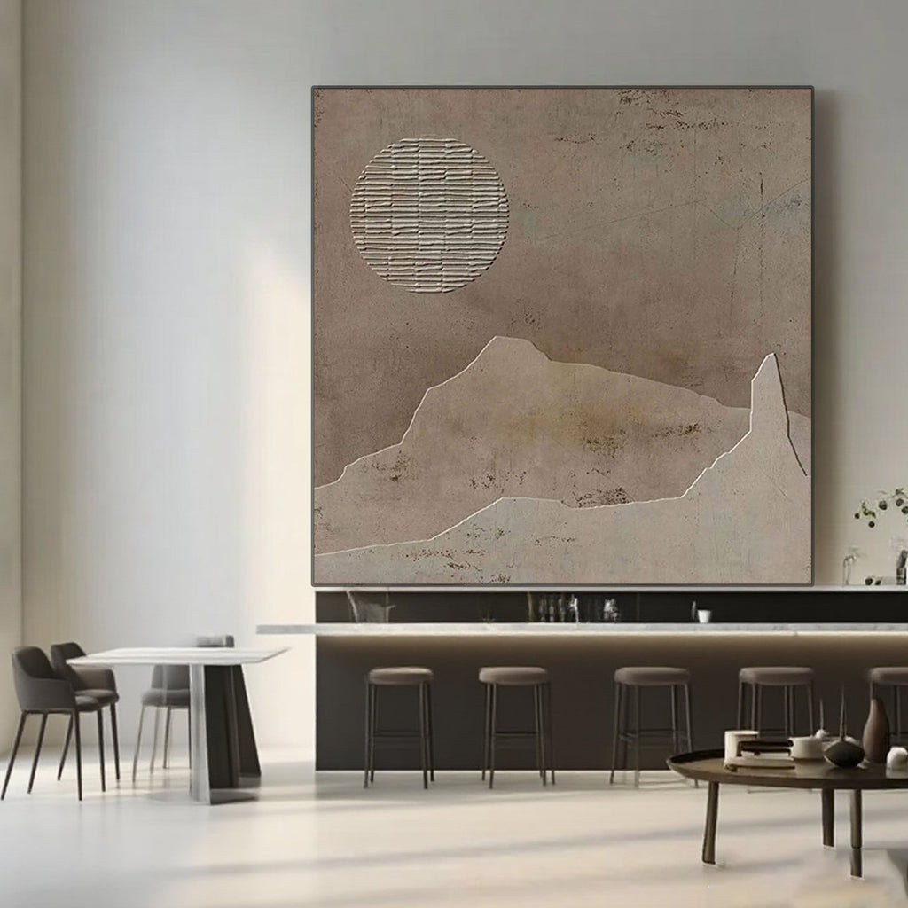 Wabi Sabi brown canvas art featuring textured sun and mountain shapes.