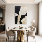 Hand-painted abstract wall art in neutral tones complements a modern dining space with gold accents and floor-length curtains.