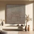Wabi Sabi square canvas art in sediment color in a living room setting.