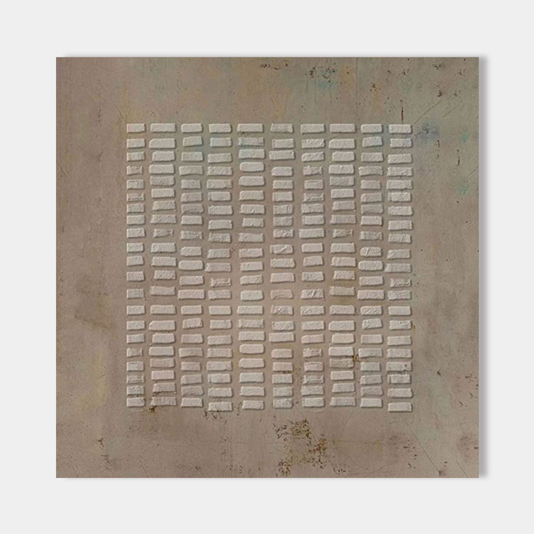 Close-up of textured brown wabi-sabi canvas art with layered rectangular patterns.